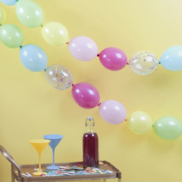 Picture of Multicoloured and confetti filled linking balloons